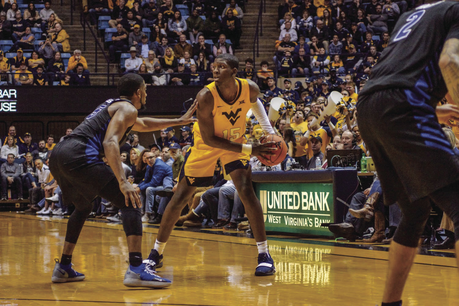 Forward Lamont West looking around the court for open teammate